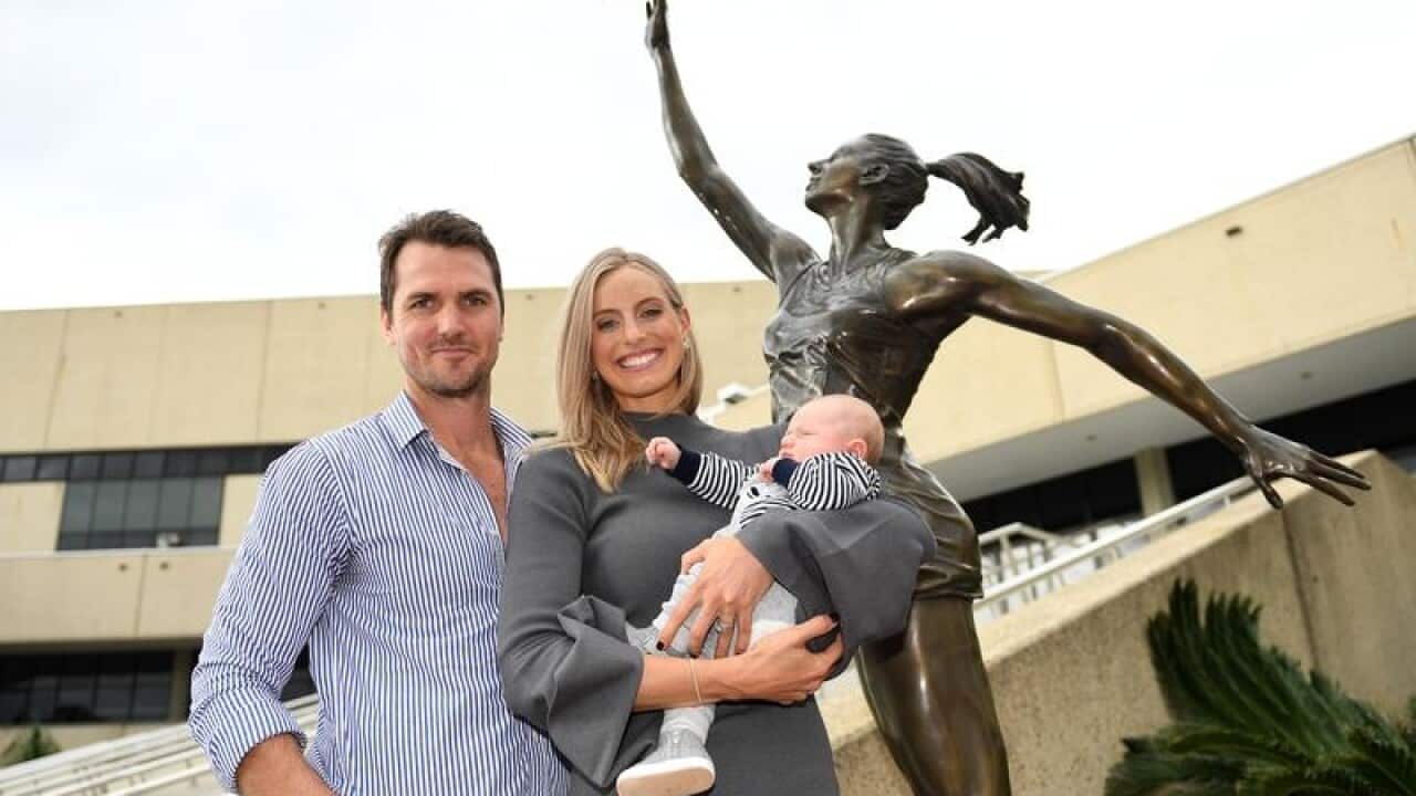 Former Australian captain Laura Geitz poses with her husband and son