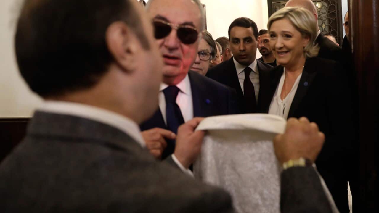 An aide of Lebanon's Grand Mufti with a head scarf