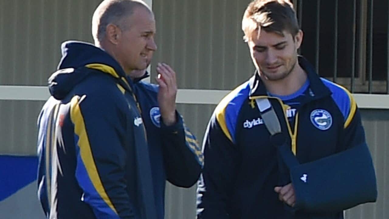 Kieran Foran (right) speaks with coach Brad Arthur