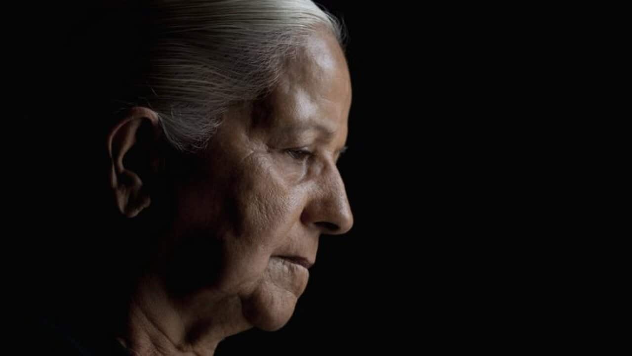 Studio portrait of senior woman