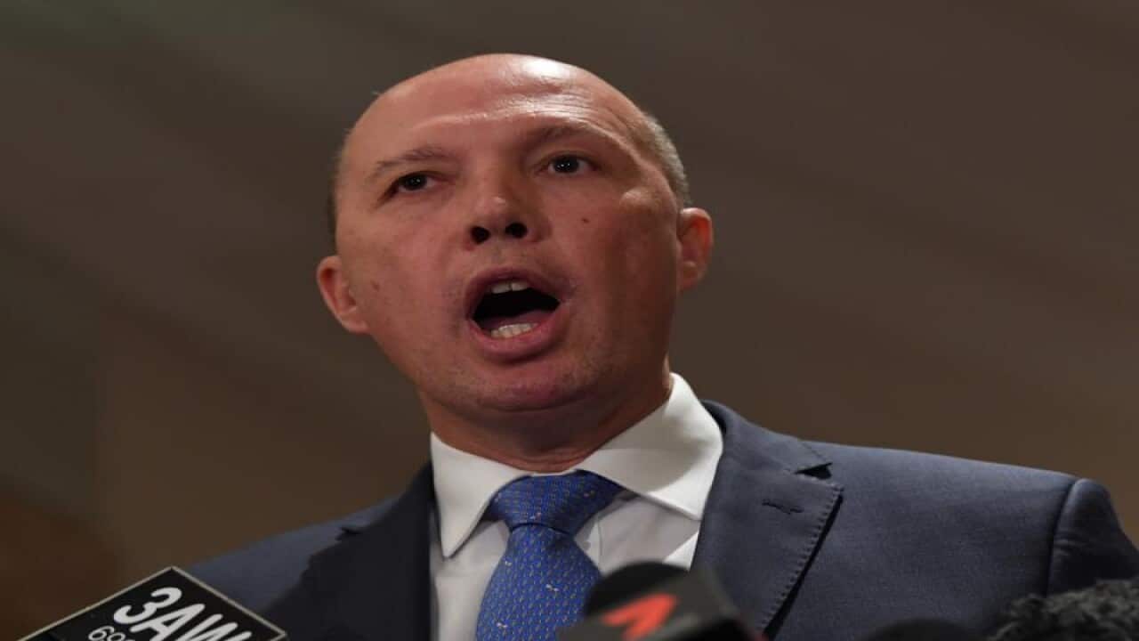 Federal Immigration Minister Peter Dutton speaks to the media