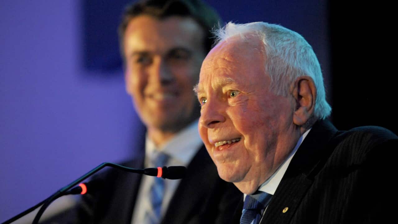 Former AAP Chairman Harry Gordon receives his plaque after he was inducted in to the Melbourne Press Club Hall of Fame, at an event in Melbourne, Friday, Oct. 11, 2013. (AAP Image/Joe Castro) NO ARCHIVING