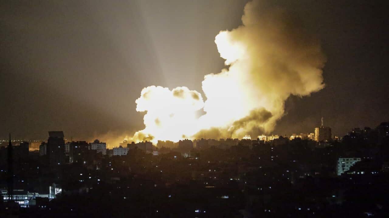 Smoke rises following an Israeli air strike in Al-Ramal neigbourhood in Gaza City (AAP)
