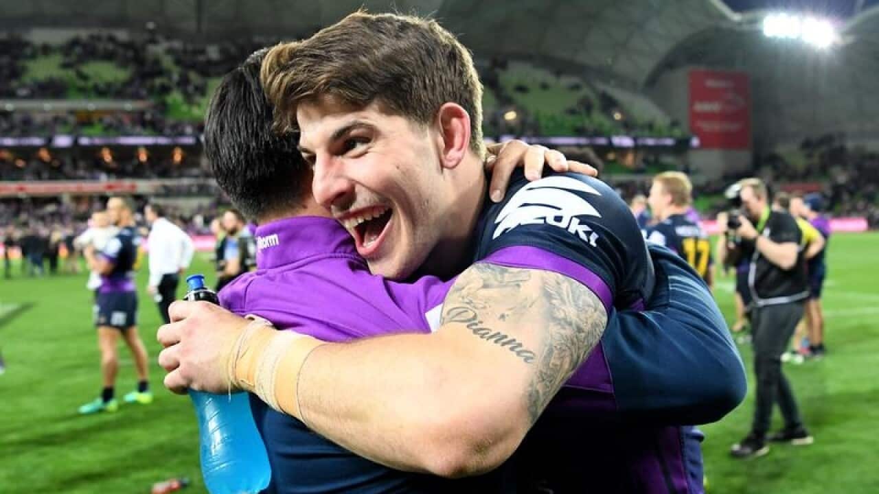 Curtis Scott of the Storm celebrates with a team mate after a game.
