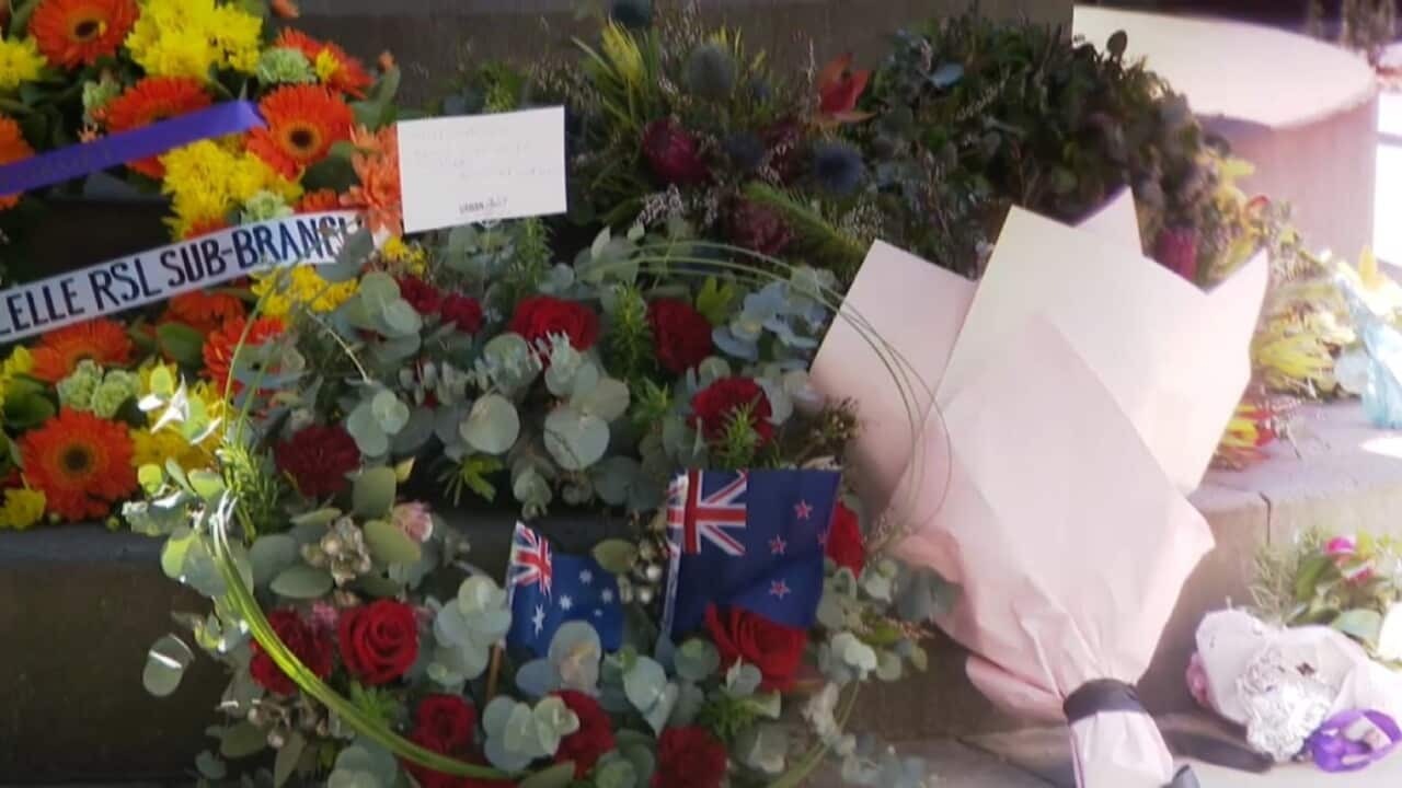 Flowers at a war memorial statue in Balmain Sydney.jpg