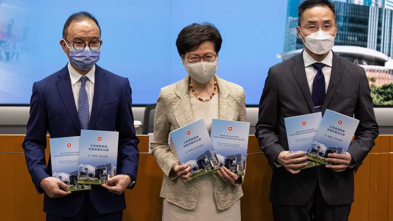 Hong Kong Chief Executive Carrie Lam and government officials Erick Tsang and Roy Tang attend a press conference about electoral system overhaul in Hong Kong.