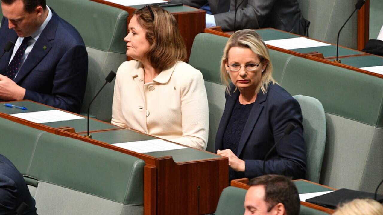 Liberal members Sarah Henderson (left) and Sussan Ley (right) in the House of Representatives at Parliament