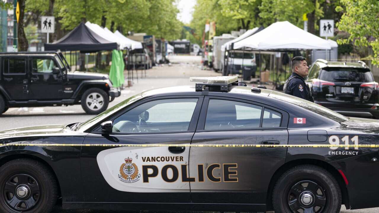 A Vancouver Police vehicle blocks the street leading to the location where a vehicle drove into crowd (AAP)