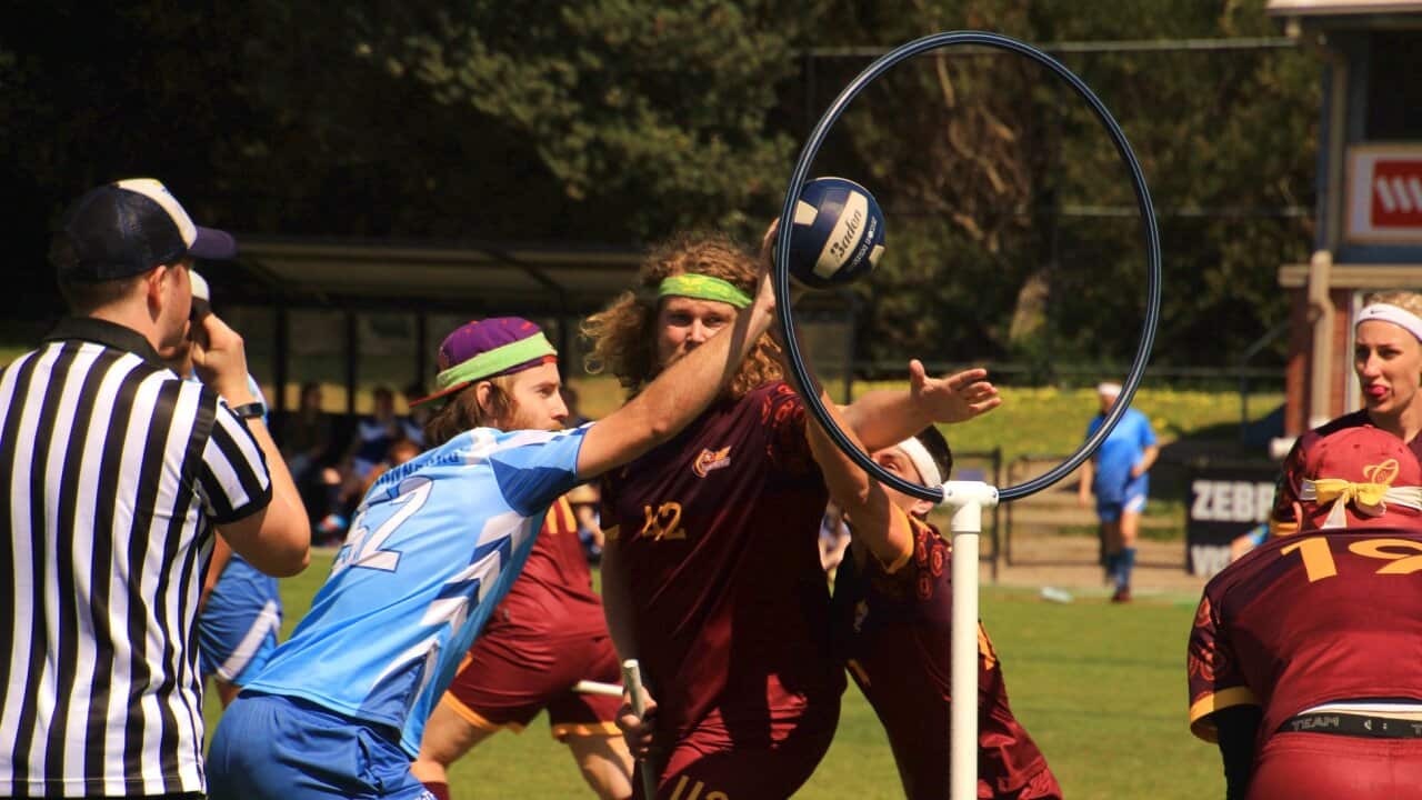 People playing a game of quidditch in Australia.