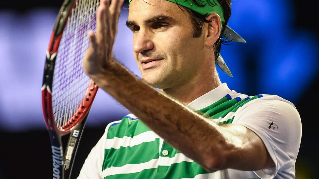 Roger Federer of Switzerland celebrates after defeating David Goffin of Belgium during their fourth round match at the Australian Open Grand Slam tennis tournament in Melbourne