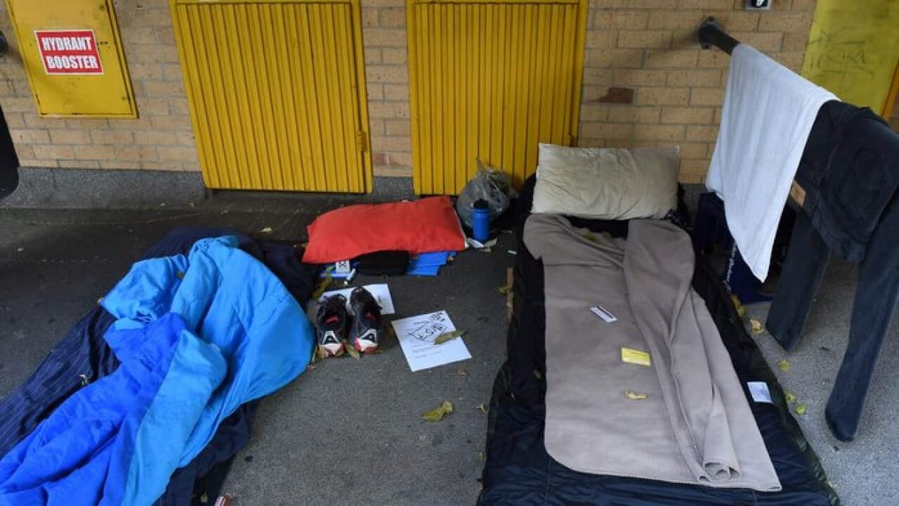The belongings and sleeping quarters of a homeless person are seen outside a carpark in central Sydney, Tuesday, March 31, 2015. (AAP Image/Mick Tsikas) NO ARCHIVING