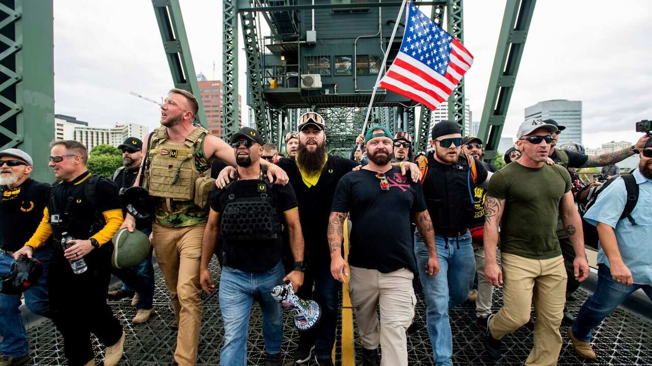 Members of the Proud Boys and other right-wing demonstrators march across the Hawthorne Bridge during an "End Domestic Terrorism" rally in Portland in 2019.