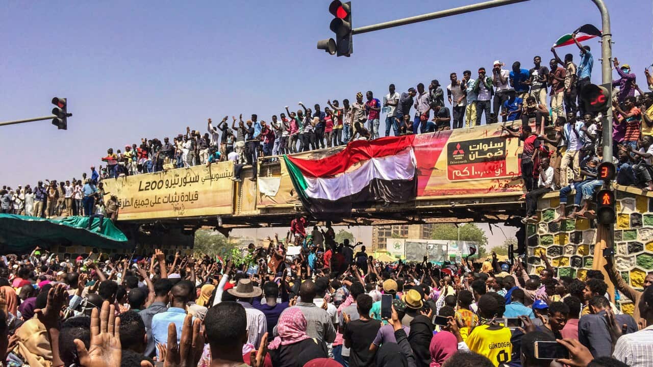 Protesters rally at a demonstration near the military headquarters, Tuesday, April 9, 2019, in the capital Khartoum, Sudan.