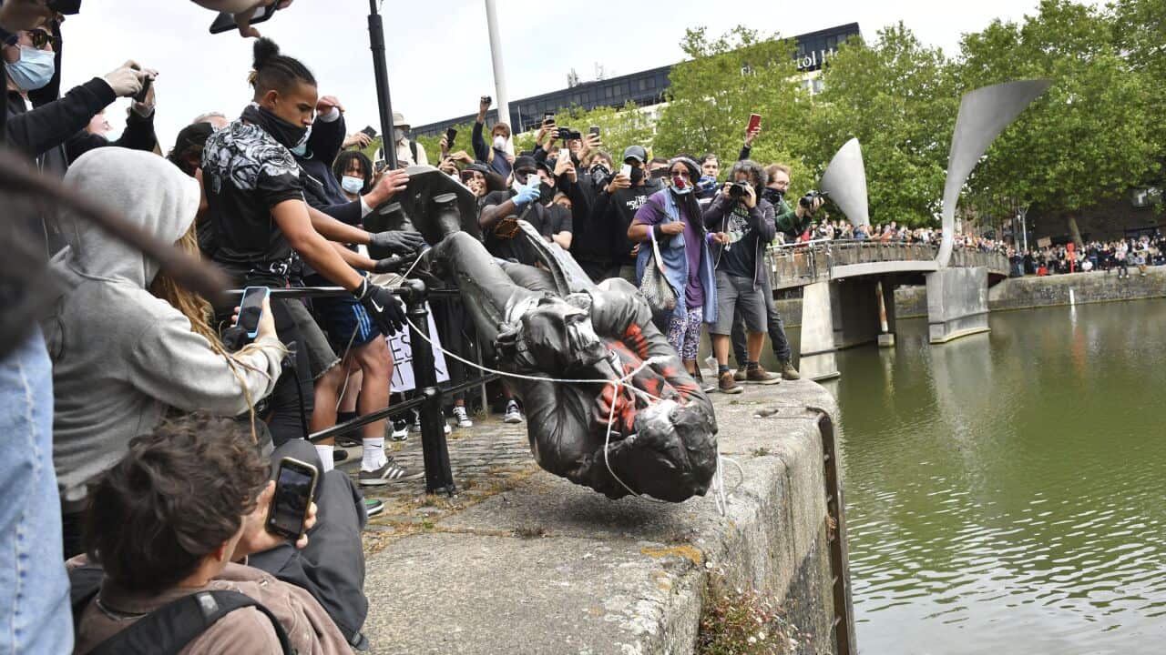 Protesters throw a statue of slave trader Edward Colston into Bristol harbour, during a Black Lives Matter protest rally, in Bristol, England.