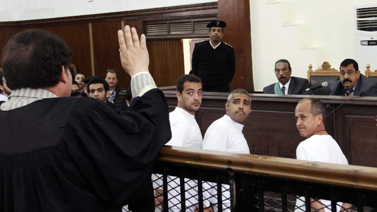 Al-Jazeera journalists appear in court in Cairo.