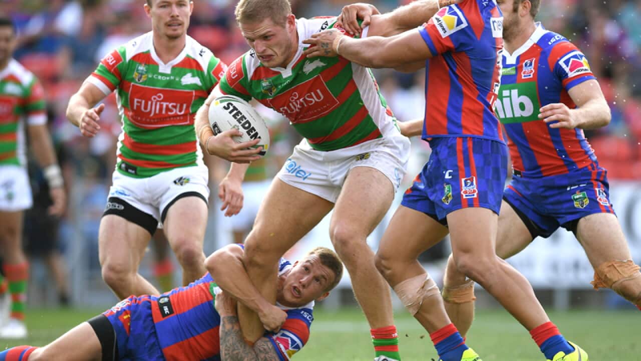 George Burgess of the Rabbitohs is tackled by Trent Hodkinson
