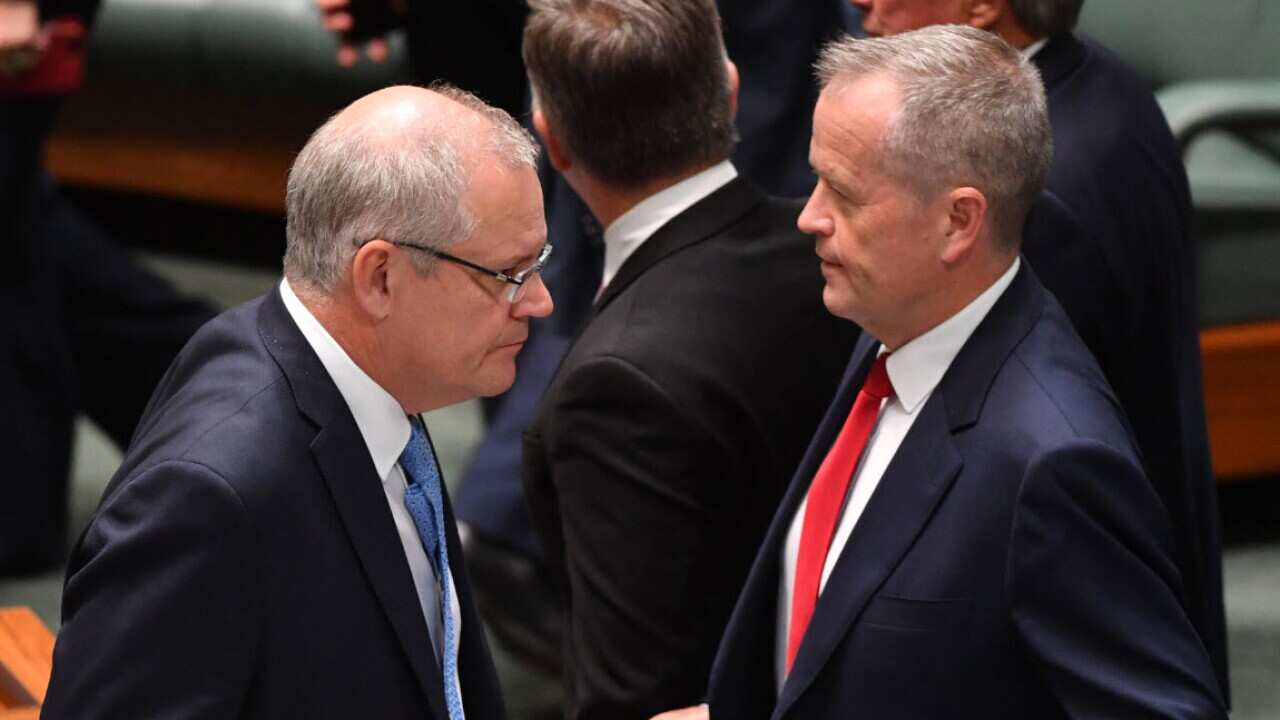 Prime Minister Scott Morrison and Leader of the Opposition Bill Shorten during division in the House of Representatives at Parliament House in Canberra (AAP)