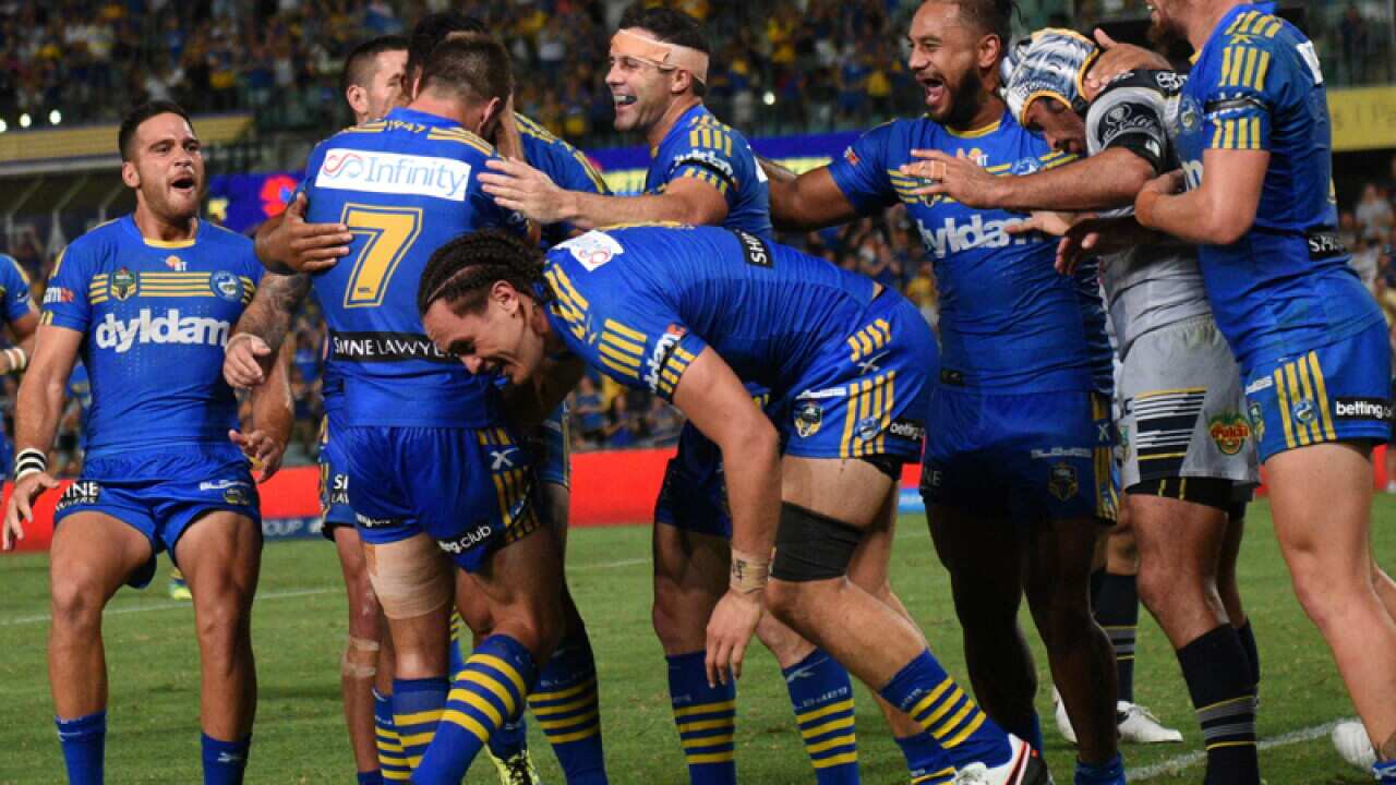 Parramatta Eels players celebrate after scoring a try