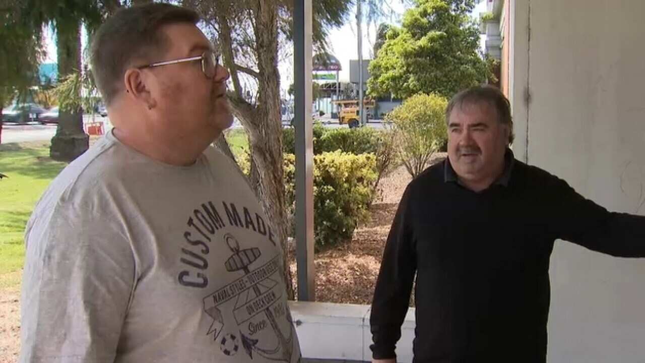 Former Ford employees Tony Anderson, left, and Henry Fuller outside old Ford factory in Geelong (SBS)