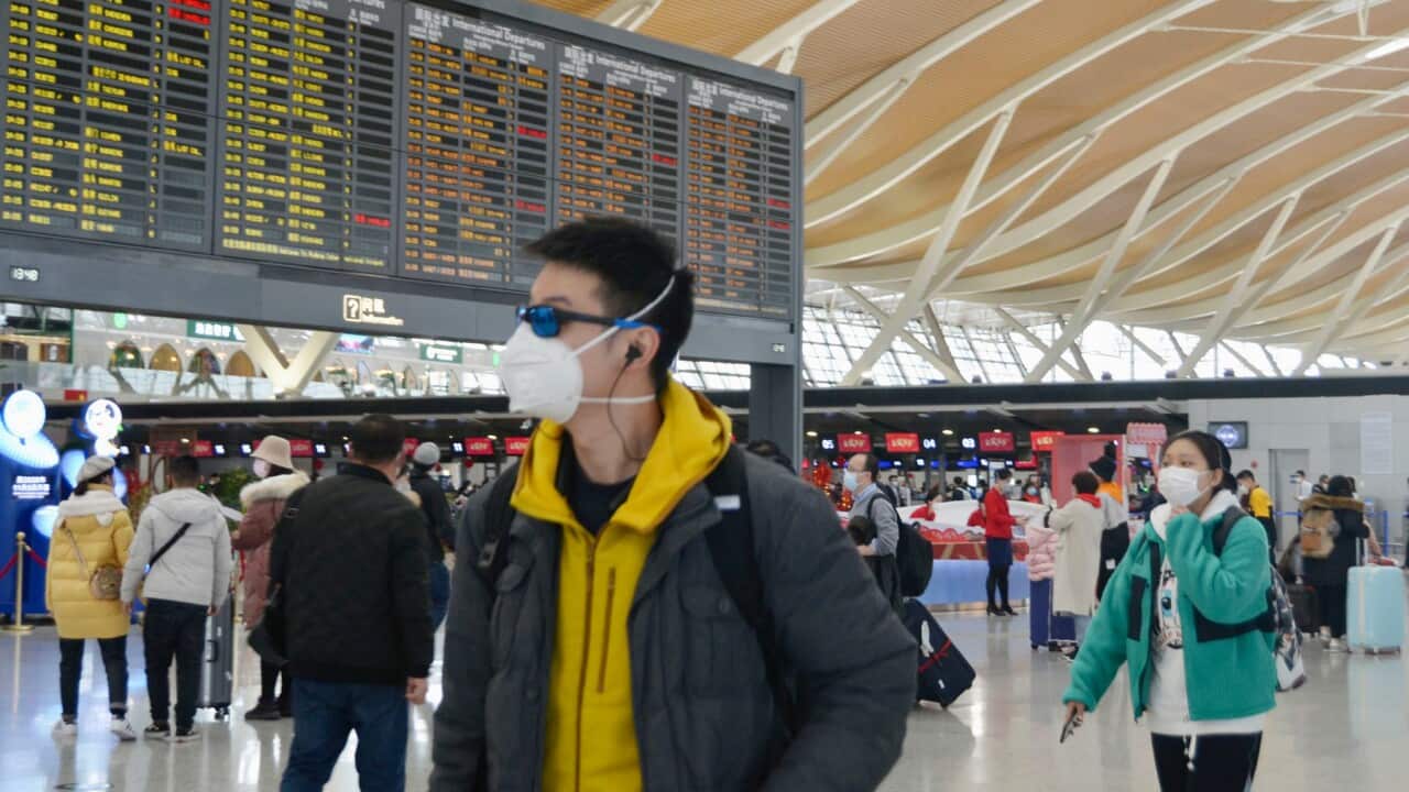 Travellers at Shanghai Pudong International Airport