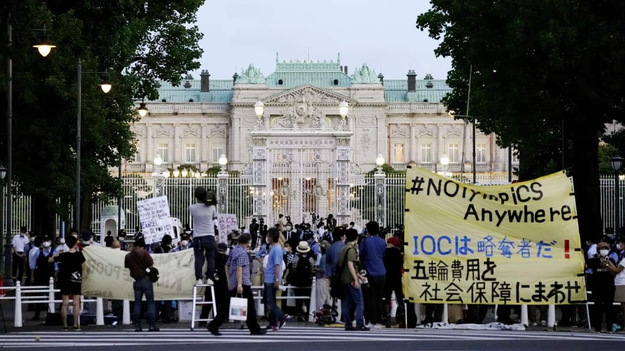 People protesting in front of the State Guest House in Tokyo against the Tokyo Olympics