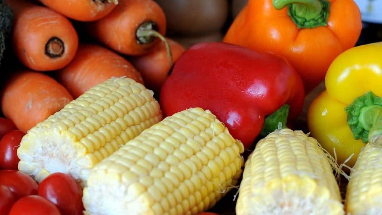 Vegetables including carrots, tomatoes and corn