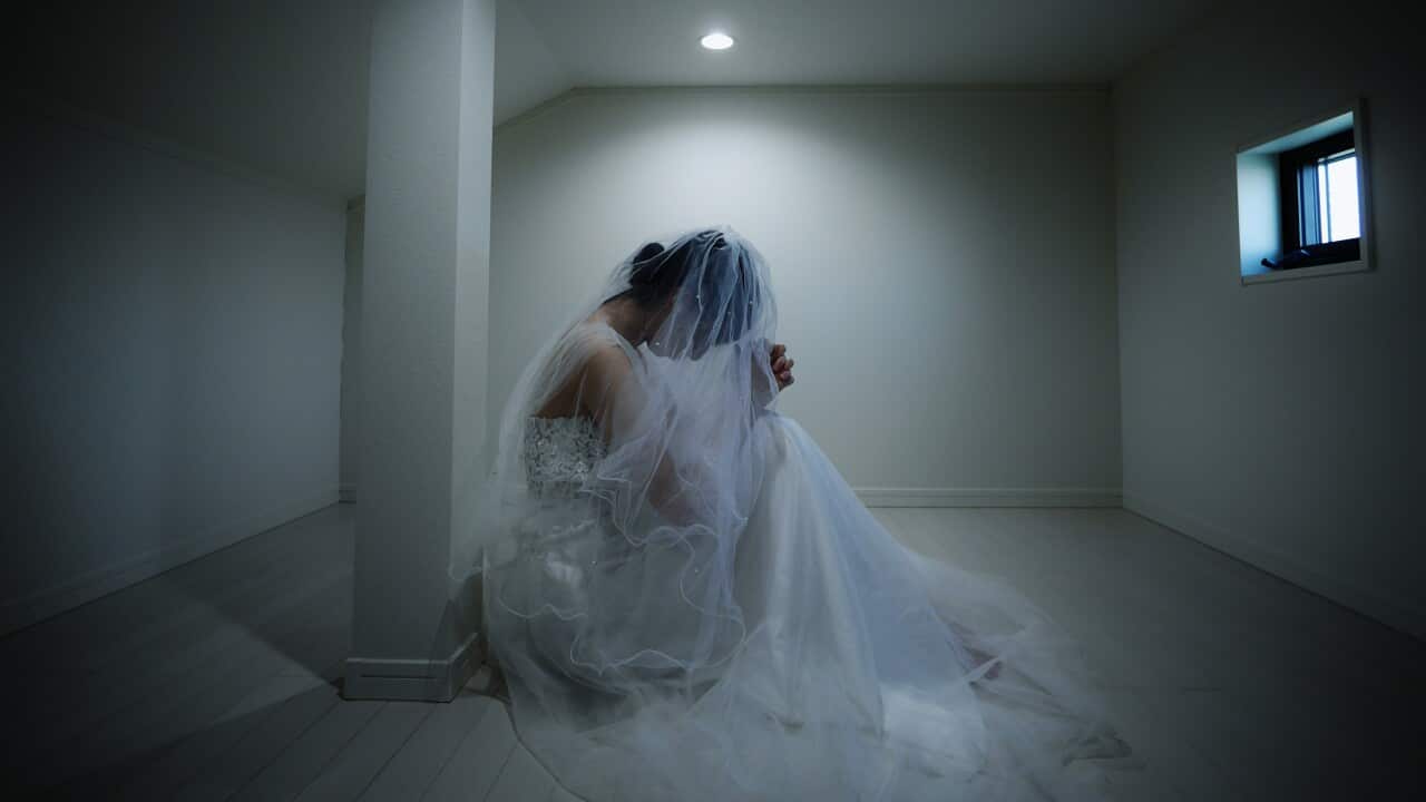 Bride praying in the attic