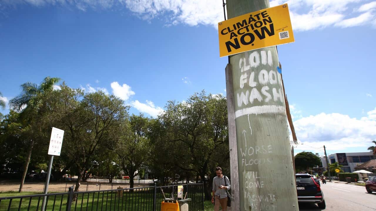 environment, business, politics A climate change sign is seen in Milton, Brisbane, Monday, March 7, 2022. Queensland, federal elections