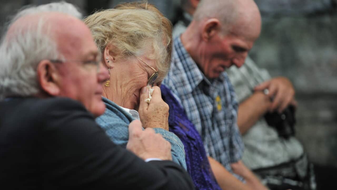 Former child migrants David Hill, Carol Walisoliso and Derek Moriart, listen to British High Commissioner Valerie Amos read a formal apology