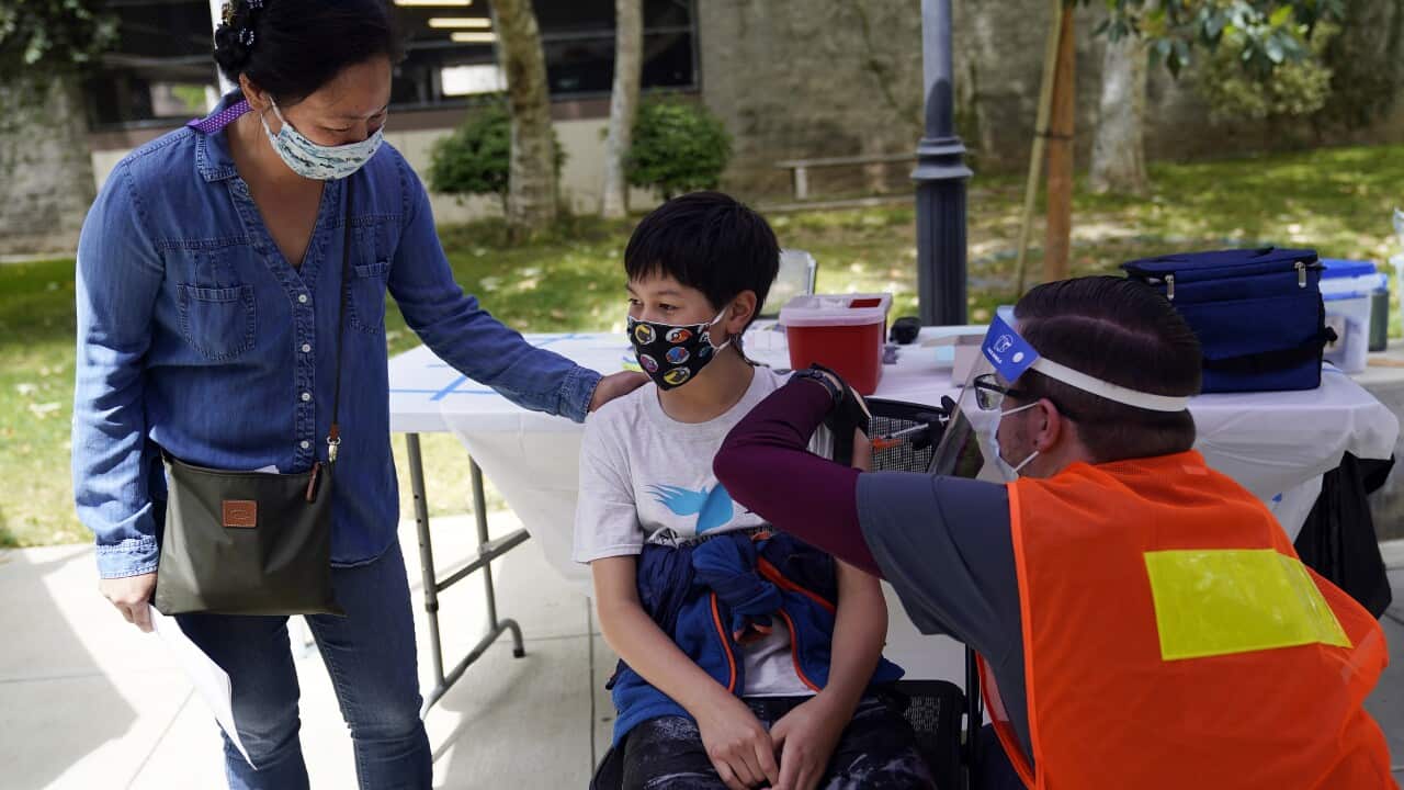 A 12-year-old boy receives a Pfizer vaccine in California. Pfizer vaccines could soon be available for children aged 5 to 11.