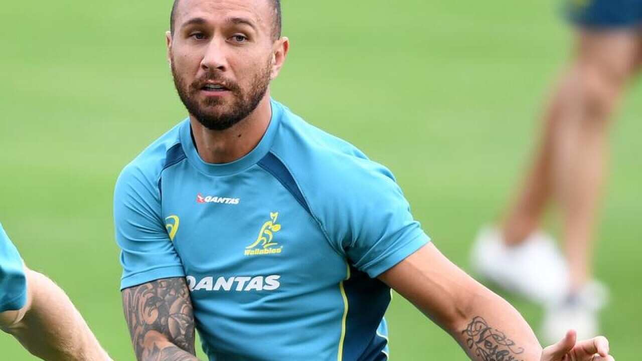 Quade Cooper passes a ball