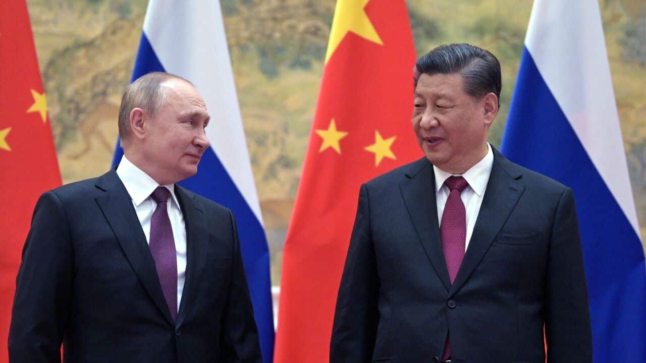Russian President Vladimir Putin (left) and Chinese President Xi Jinping pose for a photograph during their meeting in Beijing, on February 4, 2022.