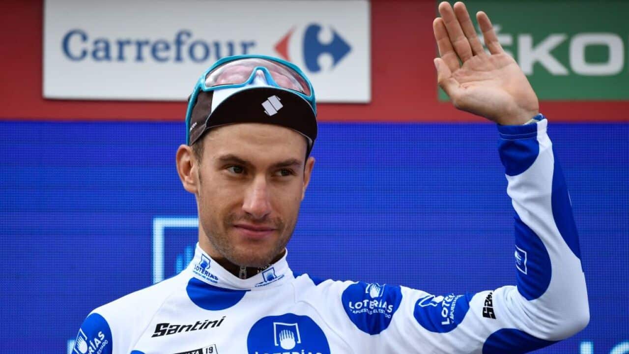 AG2R La Mondiale's Geoffrey Bouchard celebrates his best climber's polka dot jersey on the podium after the 18th stage of the 2019 La Vuelta a España (Getty)