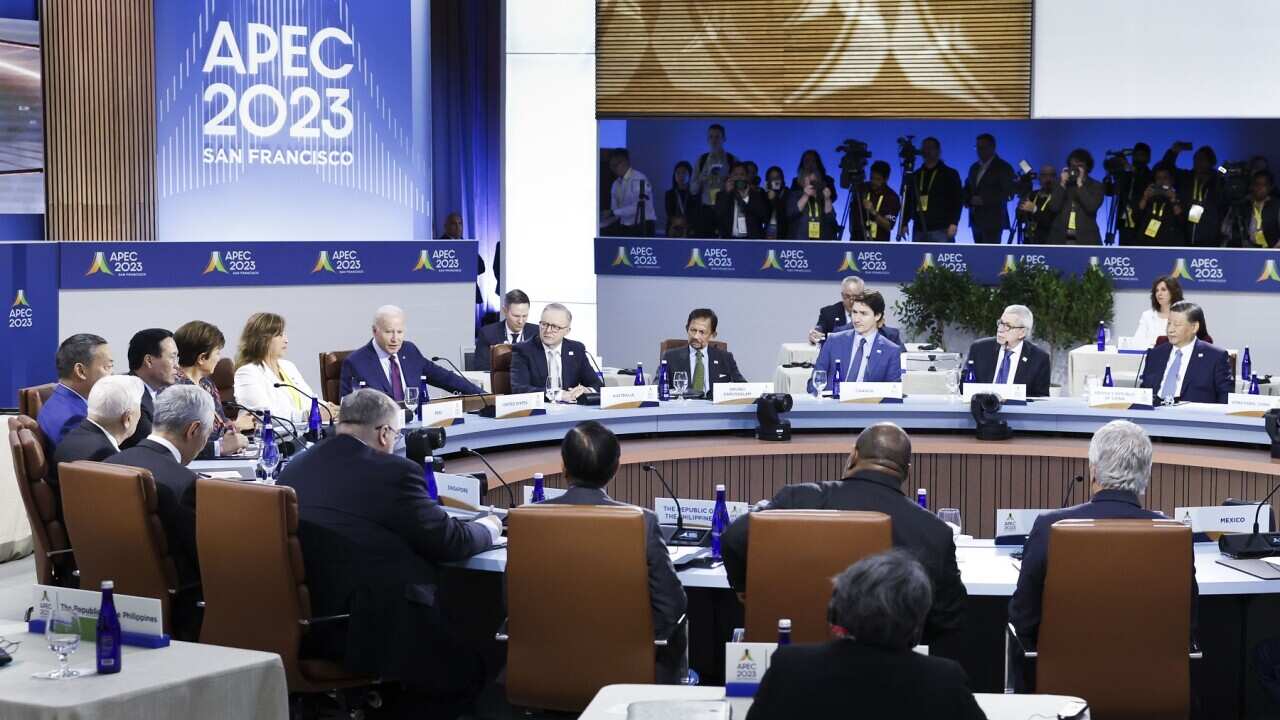 US President Joe Biden talks with Australian Prime Minster Anthony Albanese, and other world leaders gathered around the table, during the APEC Economic Leaders’ Retreat in California.