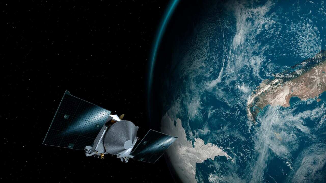 File image: NASA depicts the OSIRIS-REx spacecraft and the Earth.