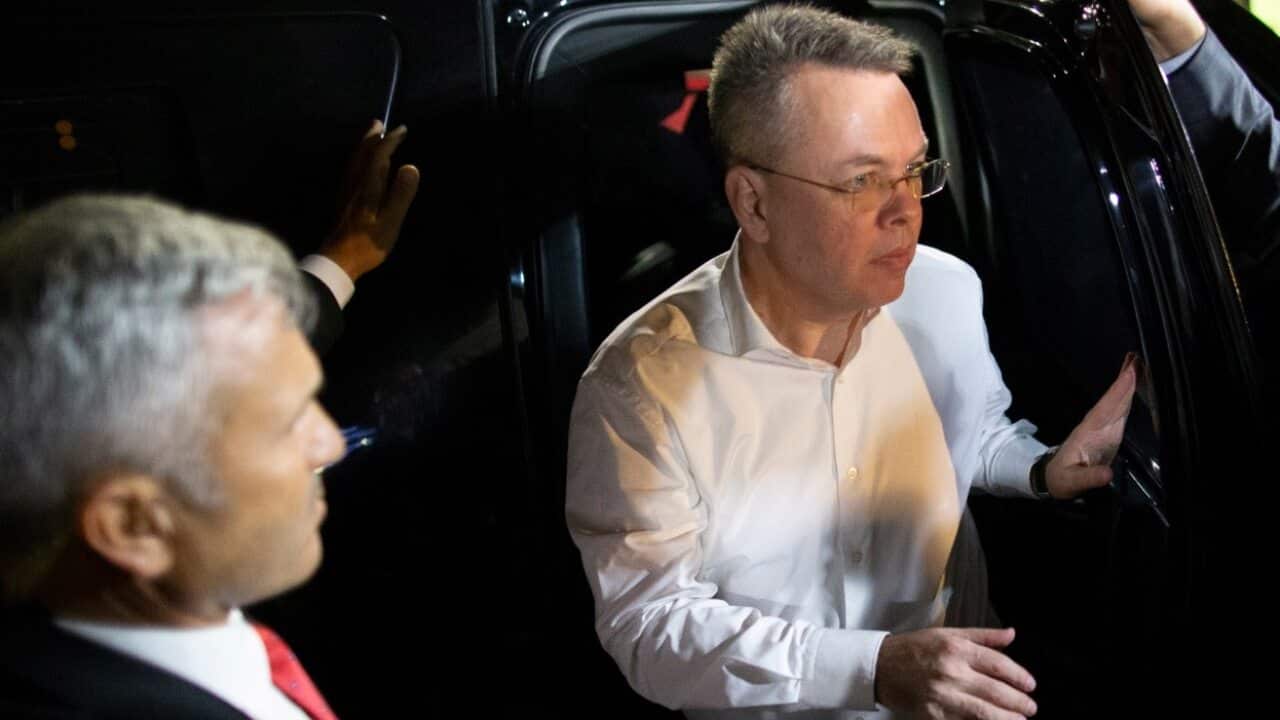 US pastor Andrew Brunson (R) arrives to Izmir Adnan Menderes Airport after he was released following his trial at the Aliaga Prison Court