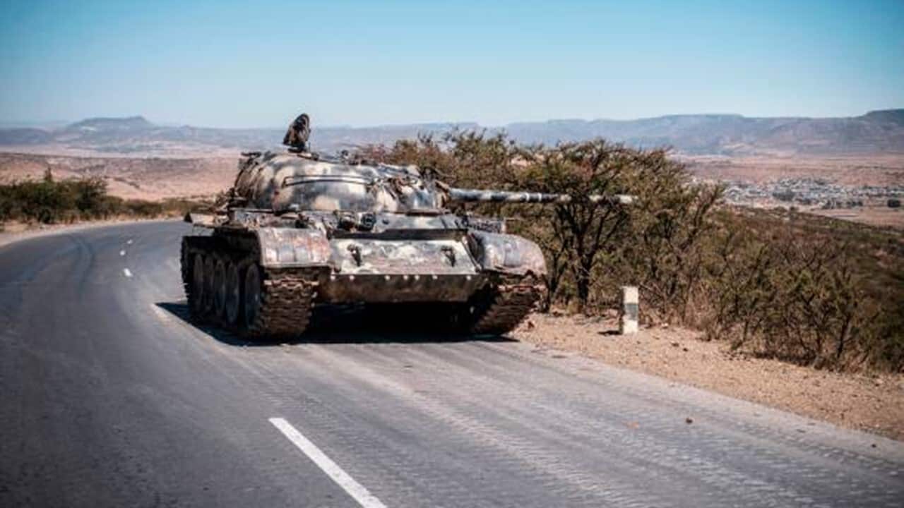 A damaged tank stands on a road north of Mekele.jpg