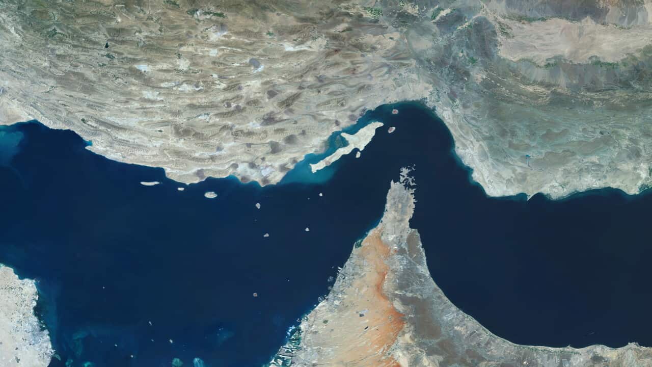 Satellite view of the Strait of Hormuz, showing the coastlines of Iran (top) and Oman and the United Arab Emirates (bottom), with surrounding islands in the Persian Gulf.