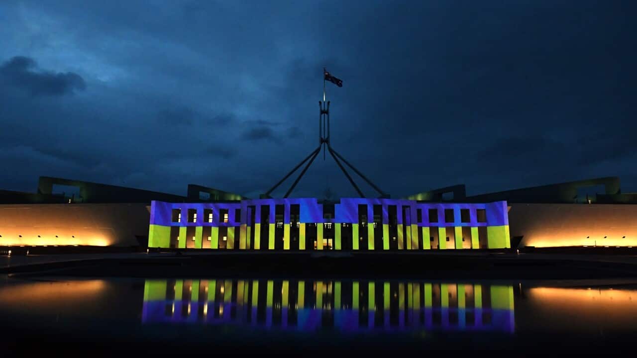 Australia’s Parliament House is illuminated with the colours of Ukraine’s flag