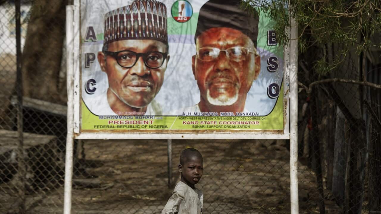 An election poster in Nigeria. Voting has been postponed.