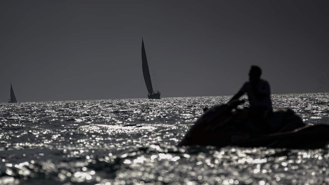 A person on a jet-ski on the ocean.