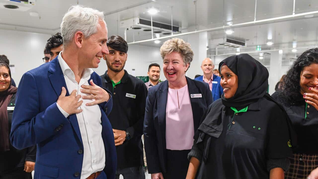 Andrew Giles speaking with refugees in Brisbane