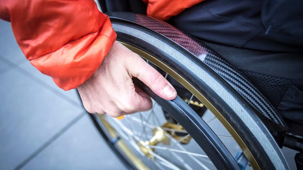 High Angle View Of Man Sitting On Wheelchair