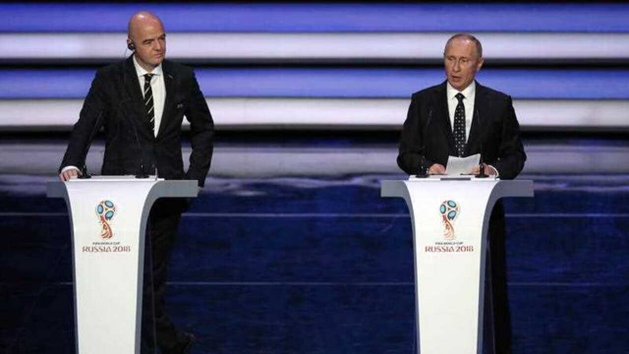 Image: Russian president Vladimir Putin (right) speaks alongside FIFA President Gianni Infantino