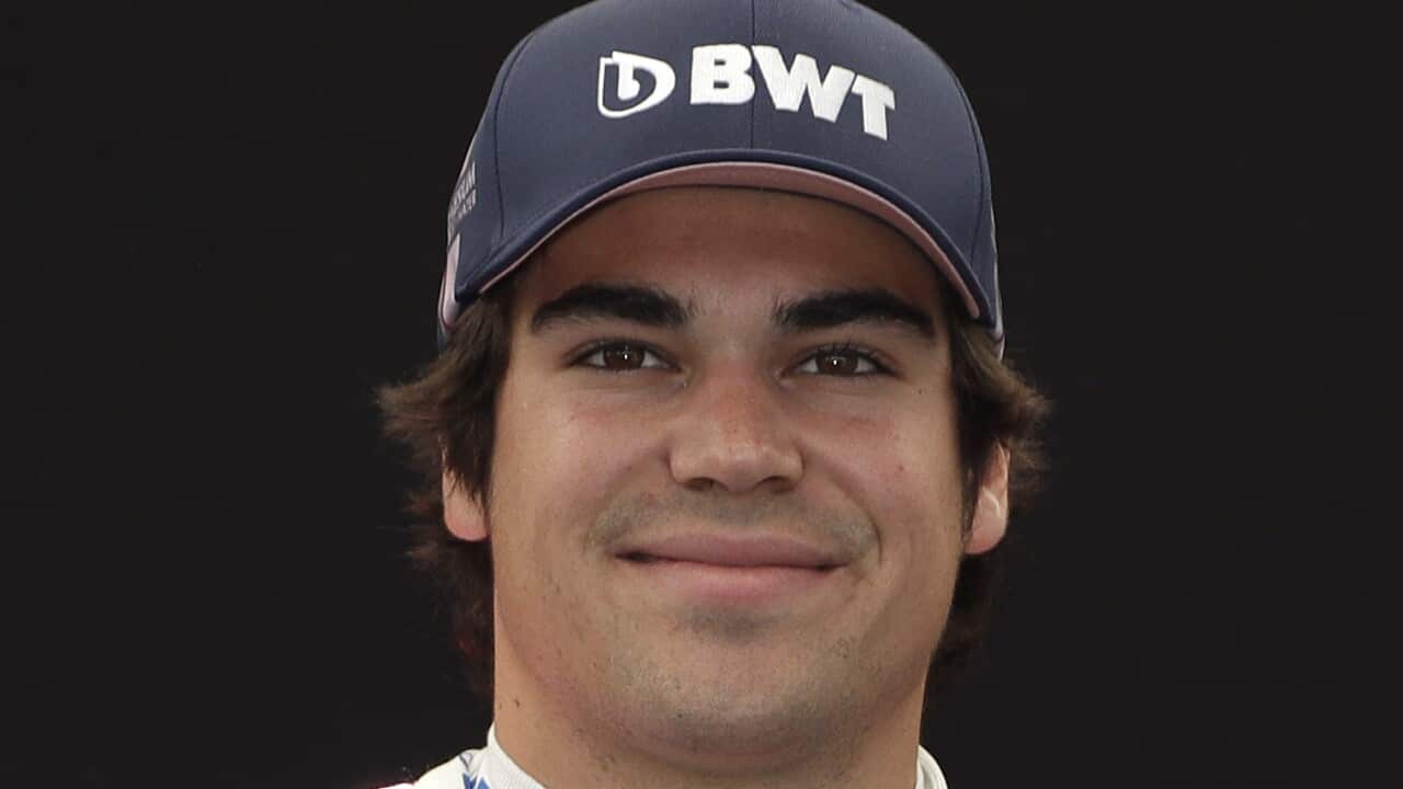 McLaren driver Carlos Sainz of Spain poses for a photo at the Australian Formula One Grand Prix in Melbourne, Thursday, March 12, 2020. (AP Photo/Rick Rycroft)