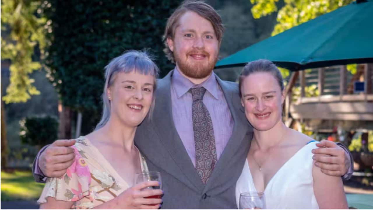 Alexandra Hudson (left) with her triplet siblings Sam and Kirsten at Kirsten's wedding.png