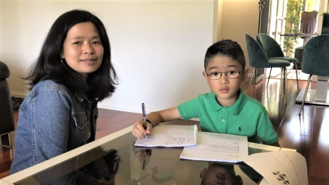 Ethan Chung (right) with his mother Aye Min.
