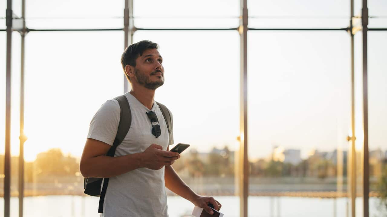 Business Man Using Mobile Phone at the Airport