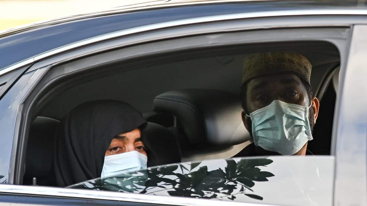 The parents of Ayaz Younus watch from a car as he is buried at the Riverstone Cemetery at Marsden Park, NSW, Wednesday, May 5, 2021. Pakistani national Ayaz Younus, died in floodwaters in Glenorie NSW in March. (AAP Image/Steven Saphore) NO ARCHIVING