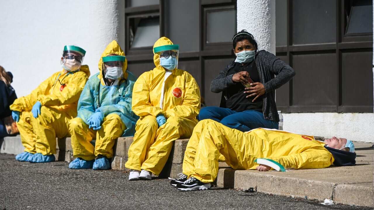 Health care professionals in New York take a break from treating coronavirus patients.